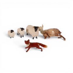 A group of Beswick models to include a Doe model 999a, Standing fox , Black faced sheep and two