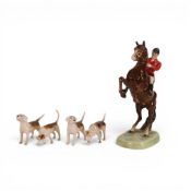 A Beswick set of a Huntsman on a rearing Horse , model 868, with 4 Hounds, Huntsman height 24cm. (