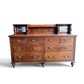 Edwardian walnut nine drawer side board with raised mirror back. Collection/courier only (H: 126cm x