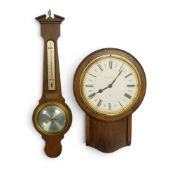 Mid-century English Elegance wall clock, featuring mahogany wood case and brass bezel, marked