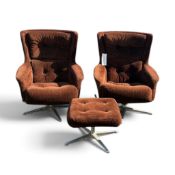 A vintage pair of mid-century brown corduroy swivel egg armchairs and a matching stool.