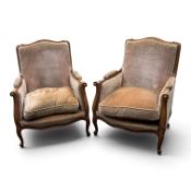 pair of French style walnut velvet upholstered armchairs, cabriole legs, with foliage carving. (H: