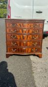 Regency style flamed mahogany serpentine chest of 5 drawers, bracket feet and brushing slide. (H: