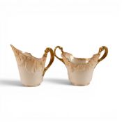 A Doulton Burslem Handled Sugar Bowl with matching cream jug , Both ornately decorated in the Rococo