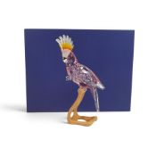 Swarovski Crystal Paradise Cockatoo, faceted pink crystal figure mounted on wooden perch (718565)