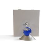 Swarovski crystal Planet was designed to celebrate the new Millennium. It comprises a blue globe