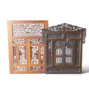Carved Indonesia wall panels, one with mirrored back, largest measurements, L99cm x W73.5cm. (2)