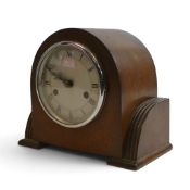 A wooden cased Art Deco arch topped mantel clock by Smiths of Enfield , silver coloured face with