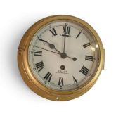 A brass cased Ships clock by Smith NW 2, diameter of face 16.5cm.