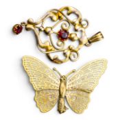 9ct Art Noveau style brooch set with red stones and 9ct butterfly brooch, 4.1g. (2)