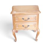 A French Louis XV-style nightstand, featuring two carved drawers and cabriole legs, H60cm x W49cm