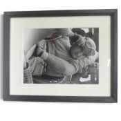 Framed black and white photograph of Jose Froilan Gonzalez, signed. (H: 44cm x W: 64cm)