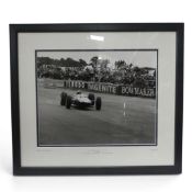 Framed black and white photograph of Jim Clark, Team Lotus, winner of the RAC British GP at