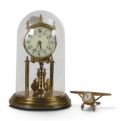 Two Clocks to include a German Anniversary clock by Kundo, together with a small clock in the form