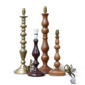 Four table lamps of Candlestick form, to include a brass example and 3 turned wooden lamps,