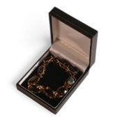 9ct gold bracelet, set with nine oval cut smoky quartz stones, 28.2g.