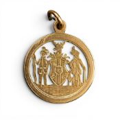 Antique 15ct pendant with pierced open design of two figures flanking a shield with stag crest, 9.