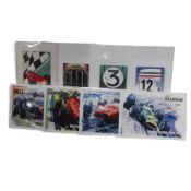 A collection of four Racing Legends art prints by John Ketchell, featuring G Hill, J Brabham, J