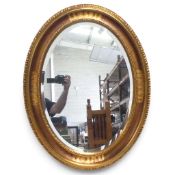 Oval gilt wall mirror, 85 x 66cm
