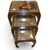 Quality vintage Chinese carved wood nest of three shaped tables, with carved ships and pagoda scenes