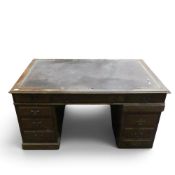 Late 19th/early 20th century leather topped partners desk with two 3-drawer pedestal cabinets.