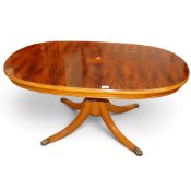 Quality burr elm veneered oval side/coffee table on turned supports, with metal paw feet, w.124 x