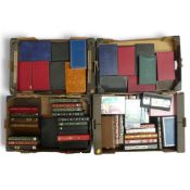 A large quantity of VHS tapes together with a collection of empty cassette boxes. Collection/courier