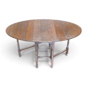 Oak dropleaf gateleg table with turned legs, extended measurements, H74cm x W151cm x D92cm.