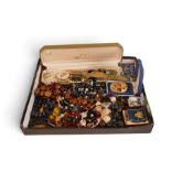 A collection of costume jewellery including strings of beads, necklaces, rings, watch, bracelets,
