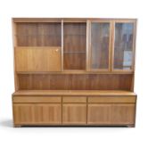 A mid-century teak display cabinet, featuring a combination of glazed display sections, drawers &