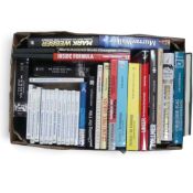 An interesting collection of motorsport books featuring Murray Walker, Mark Webber, and Al Unser,
