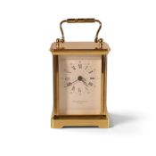 A Brass carriage clock by Taylor & Bligh of London, Roman Numeral Dial and Elegant looped handle