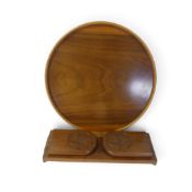 An adjustable wooden book slide, each end with hinged, carved floral motifs, together with a