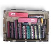 A collection of loose OO gauge passenger and freight carriages from various manufacturers