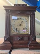 An early 20th century oak mantle clock with two 1930s clocks.