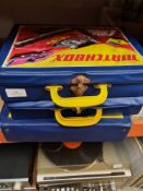 A quantity of play worn Matchbox die cast vehicles in fitted carry case.