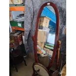 An antique dressing mirror and a modern cheval