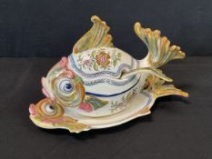 A Portuguese handpainted fish tureen and cover with conforming stand and ladle, decorated with
