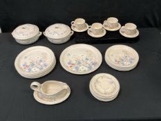 A Poole dinner/tea service decorated with wildflowers in the Springtime pattern - cups & saucers,