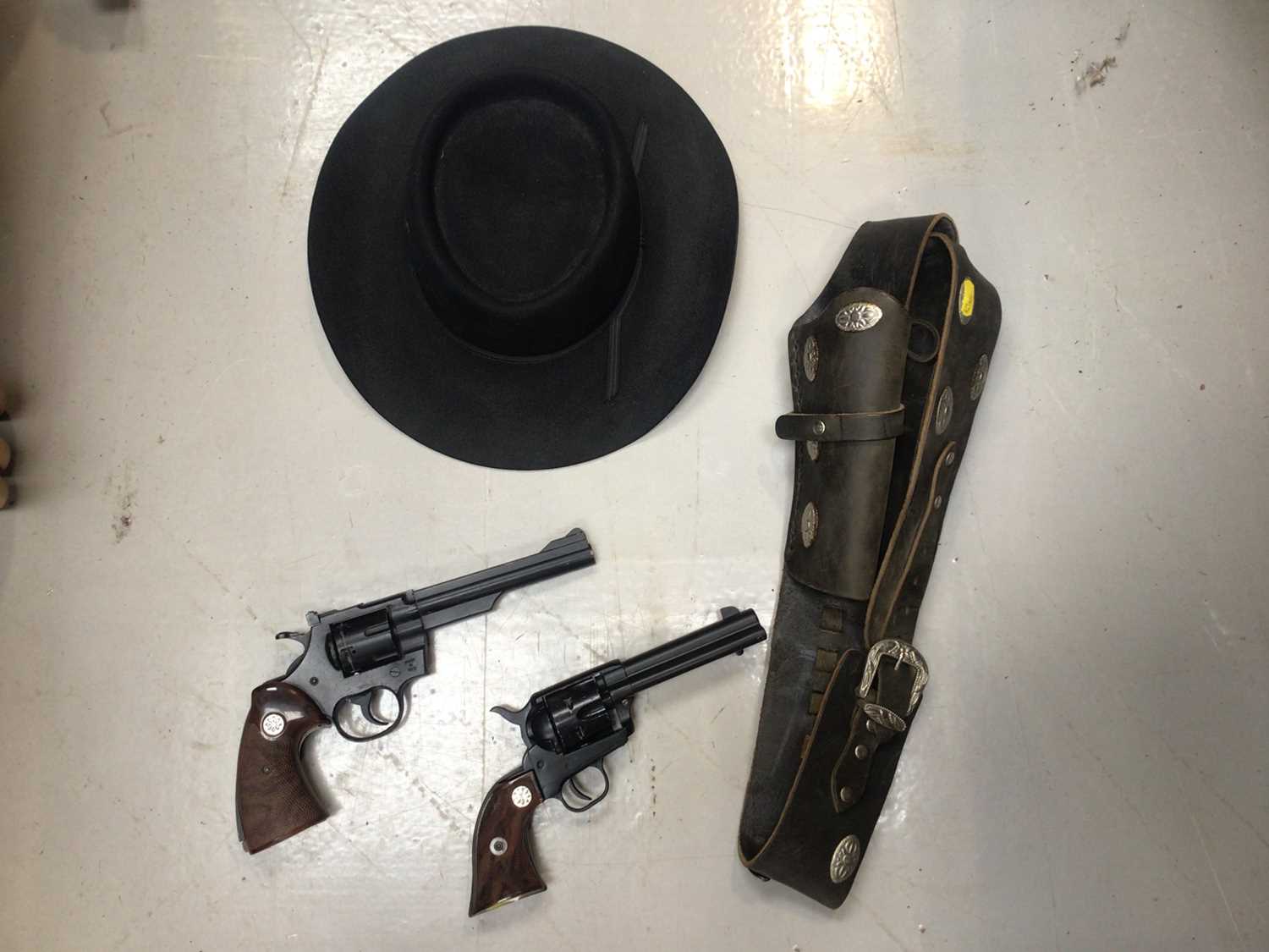 Blank firing Colt revolver with holster and Cowboy hat and another revolver