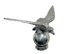 Vintage Desmo chromium plated car mascot in the form of an eagle on a ball, with screw fitting to ba