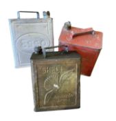 Original Shell Aviation Spirit fuel can, together with an Esso fuel can, with later added tap to bas