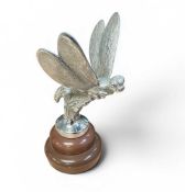 Vintage chromium plated car mascot in the form of a dragonfly, later mounted on a plastic base, masc