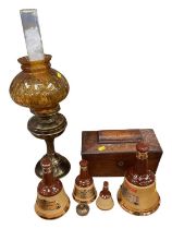 Tea caddy, bells whisky bottles, lamp