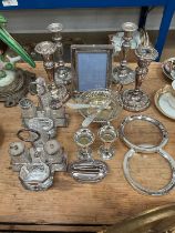 Group of silver plate, including a two pairs of candlesticks, pair of cruets, etc