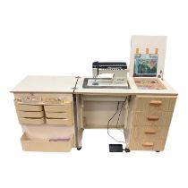 Horn sewing machine cabinet with Singer Futura sewing machine and accessories.