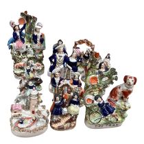 Group of twelve Victorian Staffordshire pottery figure groups