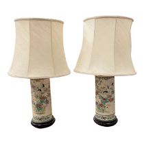 Pair of early 20th century Japanese vases converted to table lamps, on hardwood stands