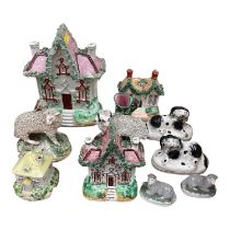 Group of Victorian Staffordshire pottery animals and houses