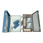 1950's / 60's Four person picnic set in brown and together with partial picnic in a blue case (2).
